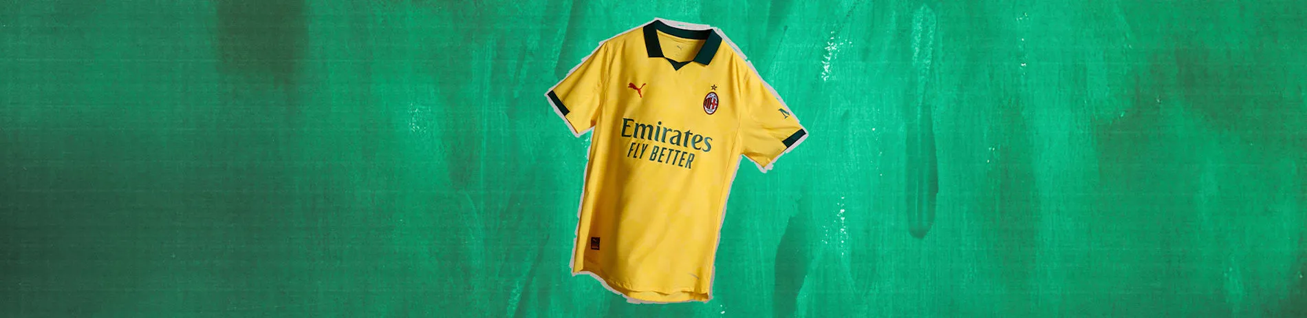 AC Milan Ausweichtrikot 25/26 in Gelb für Herren, präsentiert vor modernem Hintergrund.