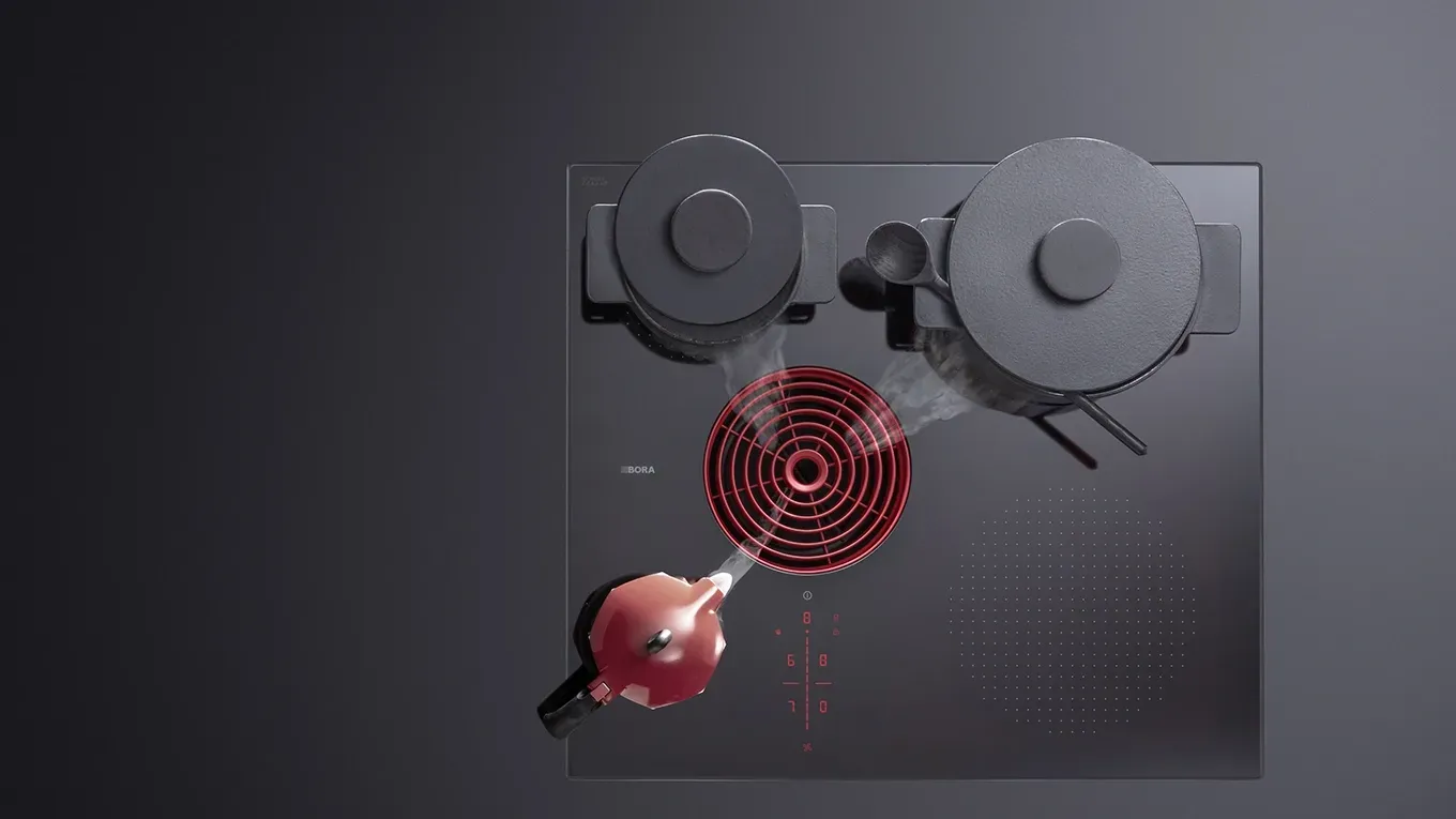 Bora S Pure Kochfeld mit integriertem rotem Kochfeldabzug und drei Töpfen, zwei schwarz, einer rot