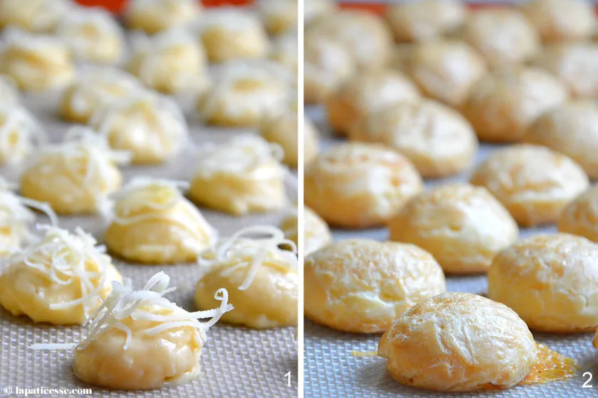 Brandteig Gougères frisch auf ein Backblech gespritzt und mit geriebenem Käse bestreut, bereit zum Backen. Ein wichtiger Schritt im Brandteig Rezept.