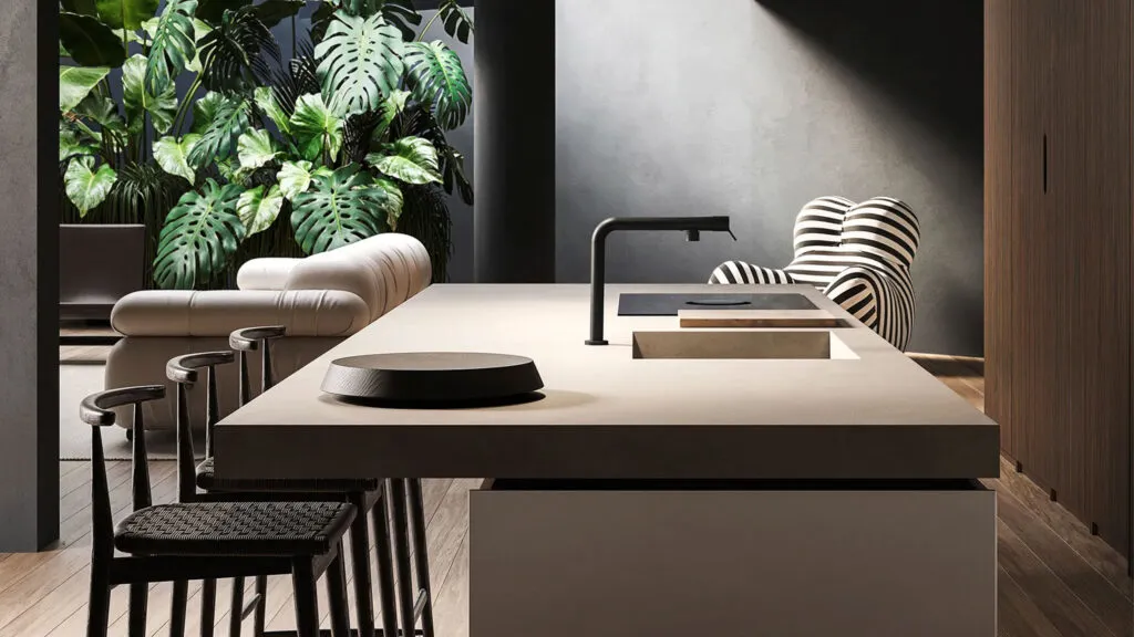 Ein eleganter schwarzer Gessi Wasserhahn, der in eine minimalistische Kochinsel integriert ist und Luxus ausstrahlt.