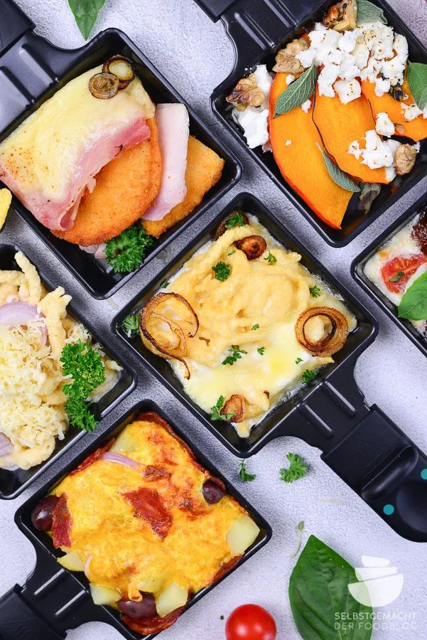 Kartoffel-Chorizo-Pfännchen mit Oliven und Ei-Käse-Mischung, eine würzige und deftige ausgefallene Raclette Idee.