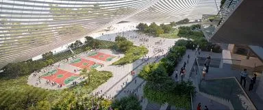 Luftaufnahme des Stadionkomplexes mit umliegenden Sportplätzen und üppigen botanischen Gärten, die eine grüne Oase bilden.