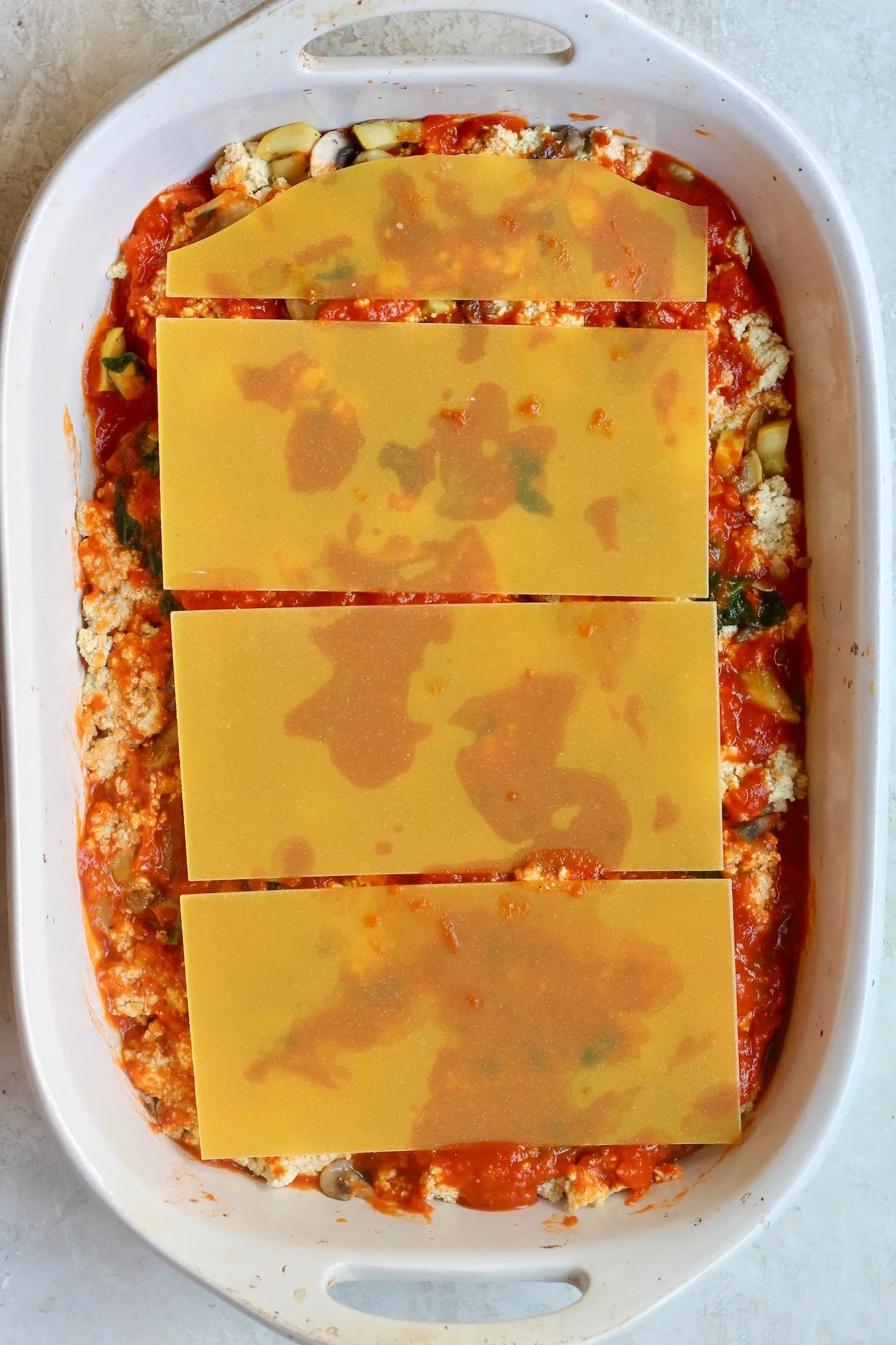 noodles and sauce in rectangular dish