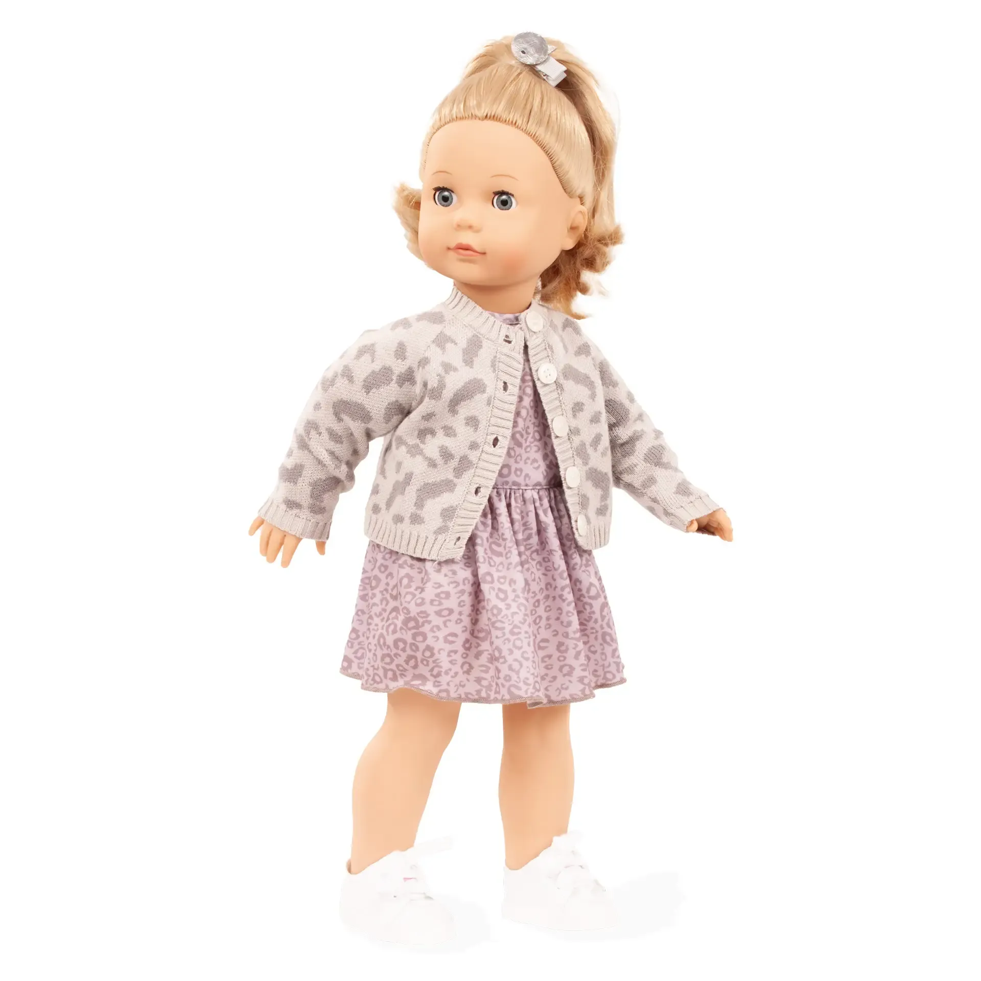 Seitenansicht einer Puppe mit blonden Haaren und einem gemusterten Kleid.