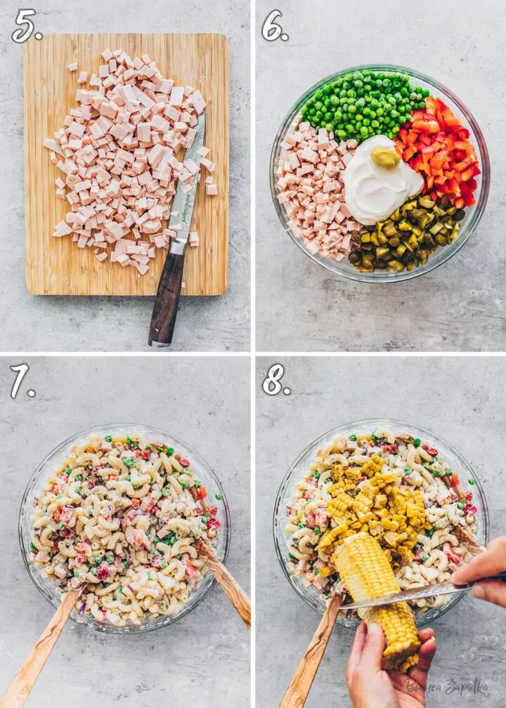 Vermengen der gekochten Nudeln mit geschnittenem Gemüse und Dressing für den veganen Nudelsalat.