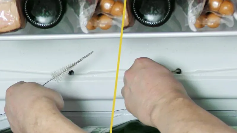 Der Ablauf wird vorsichtig mit der Bürste gereinigt, um Verstopfungen zu lösen.