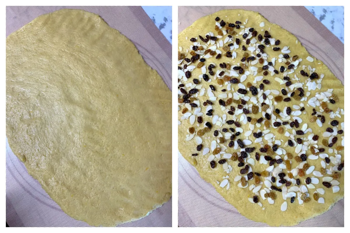 Der ausgerollte Hefeteig, reichlich bestreut mit Rum-Rosinen und gehackten Mandeln, bereit zum Aufrollen