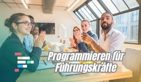 Ein Bild von Personen, die an Laptops sitzen und programmieren, möglicherweise in einem Workshop-Setting