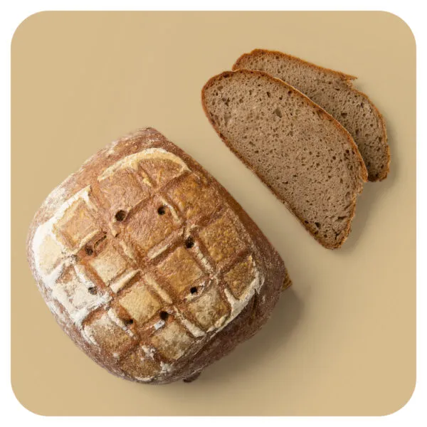 Ein Roggen Pur Brot, dunkel und rustikal, bereit zum Anschneiden