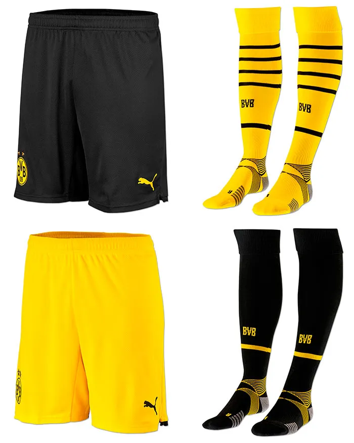 Ein Spieler von Borussia Dortmund präsentiert das komplette Heimtrikot-Set 2021/22
