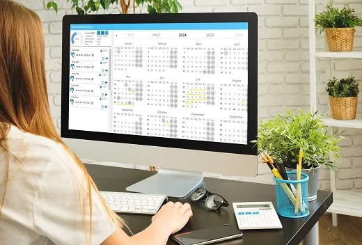 Mitarbeiter planen Urlaub mit einer Software