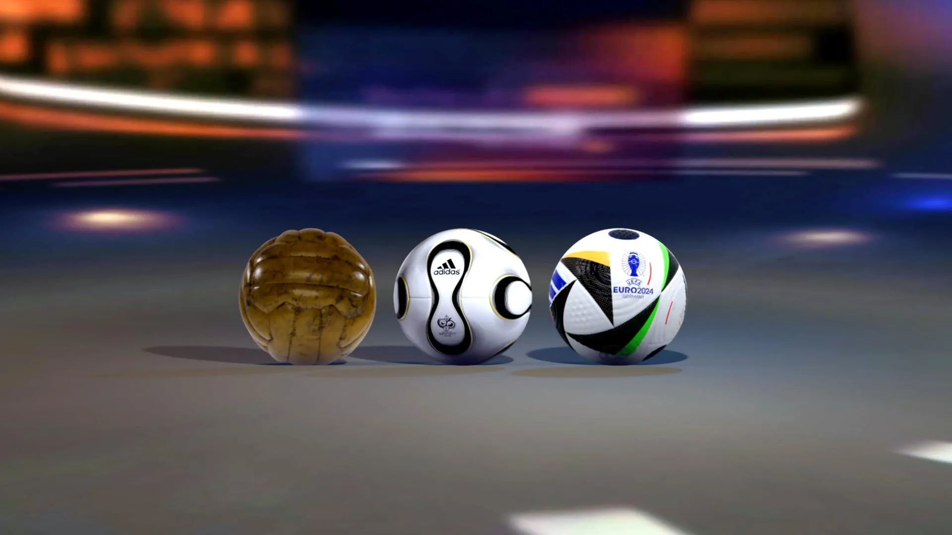 Verschiedene Fußbälle von der WM 1954 über die WM 2006 bis zur EM 2024, die die technologische Entwicklung zeigen