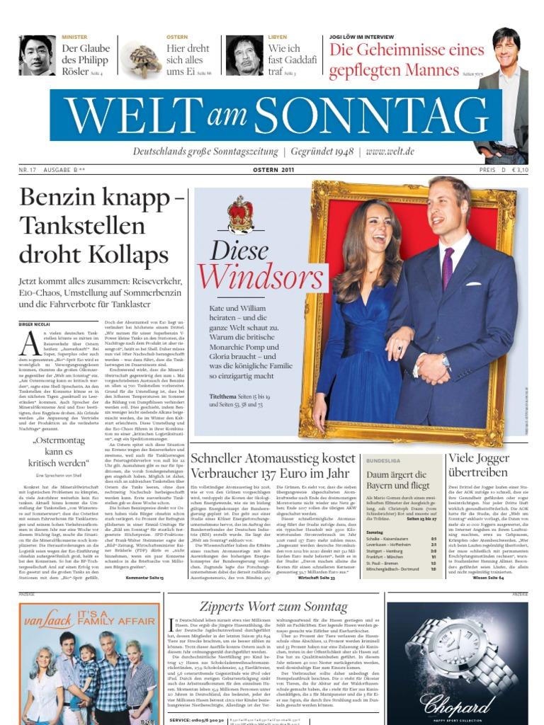 Sebastian Vettel feiert enthusiastisch einen seiner Red Bull-Siege, mit der deutschen Flagge im Hintergrund.