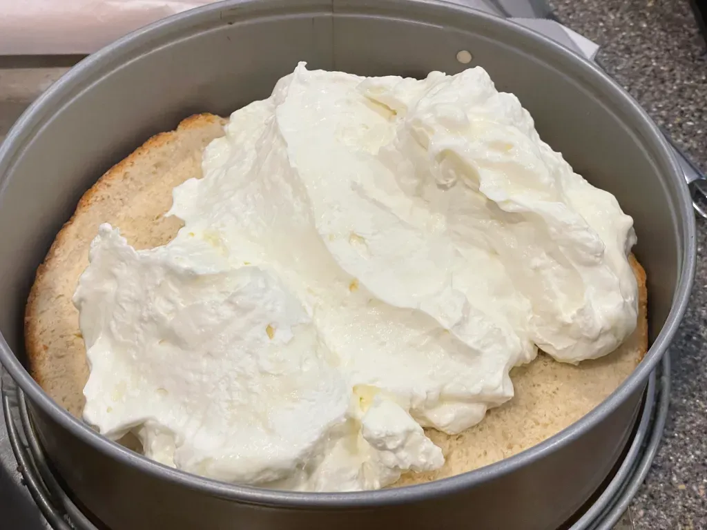 Spread the cream mixture on top of cake bottom