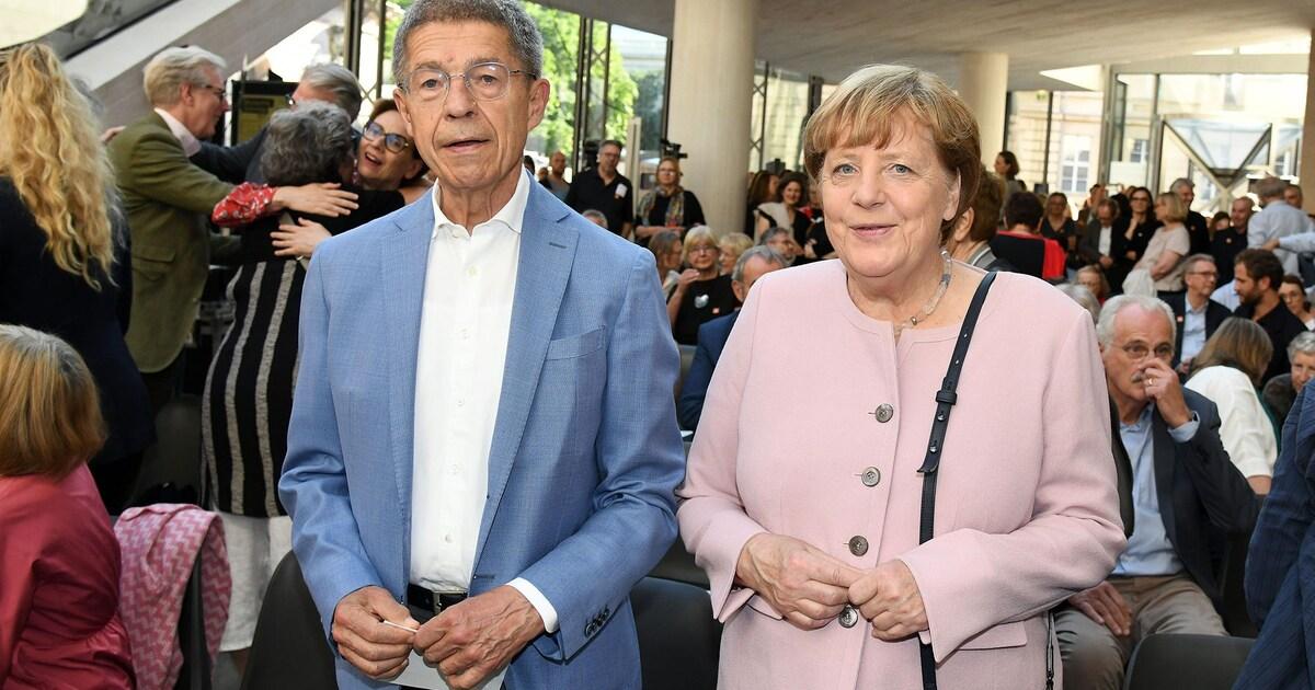 Angela Merkel und ihr Ehemann Joachim Sauer bei einem öffentlichen Auftritt, ein seltener Einblick in ihr Privatleben